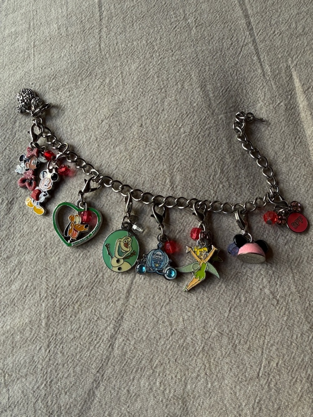 Disney charm bracelet with eight authentic Disney charms
